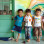 Group of small children standing outside a classroom